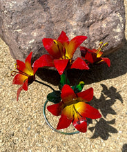 Load image into Gallery viewer, Metal red lily bouquet with green stems and leaves.