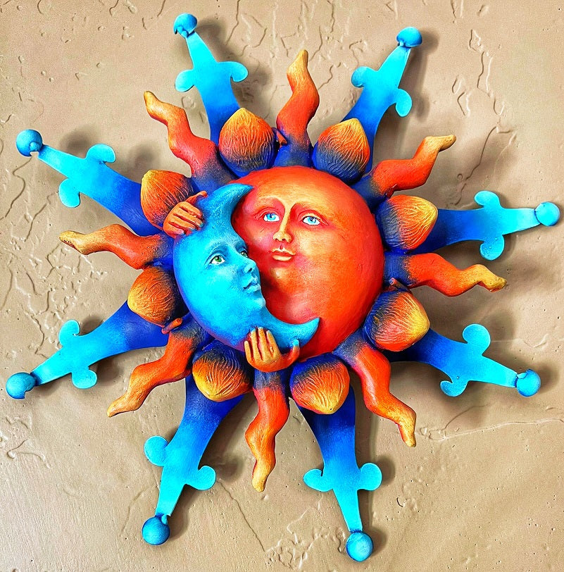 sun holding moon wall decor
