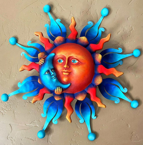 sun holding blue moon wall decor